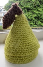 This little pear, at one time, had a little crochet snail inside. That snail is long gone. He is probably under a bookcase that never gets pulled out to vacuum behind because I figure, if I can`t see the dust, neither can anyone else.
