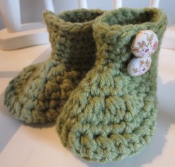 Infant wool boots with hand made fabric buttons.